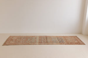 This is a Persian Malayer runner rug with a beautiful palette of blues and terracotta and a wonderful patina. Persia produces this finest carpets and this is one of them.