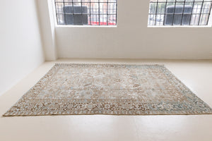 This is a beautiful muted Persian Heriz carpet from Persia. This hand woven rug features a lovely blue grey and brown colour palet.