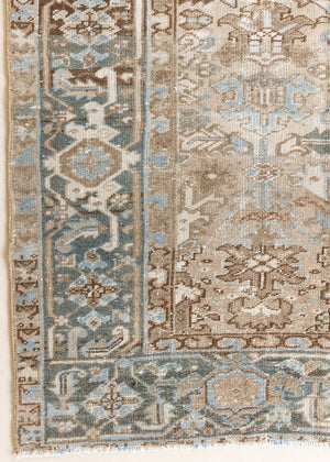 This is a beautiful muted Persian Heriz carpet from Persia. This hand woven rug features a lovely blue grey and brown colour palet.
