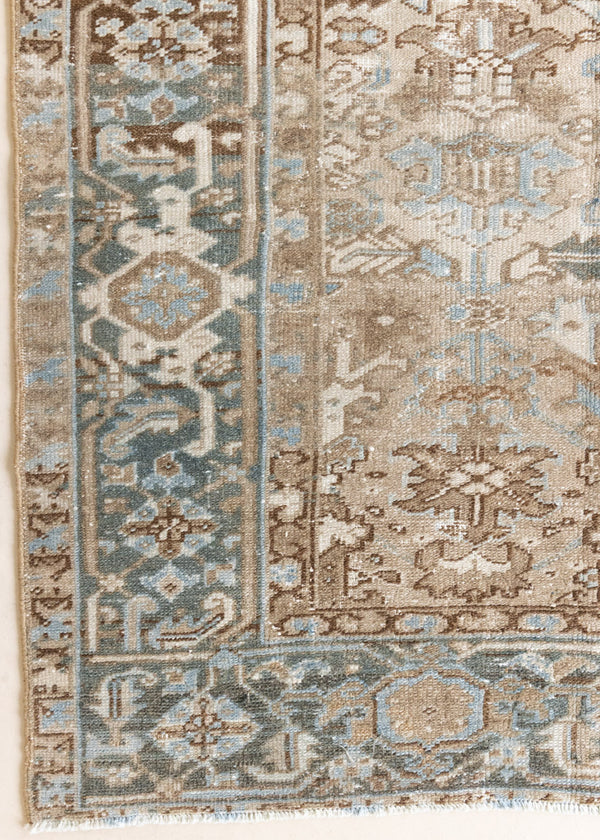 This is a beautiful muted Persian Heriz carpet from Persia. This hand woven rug features a lovely blue grey and brown colour palet.