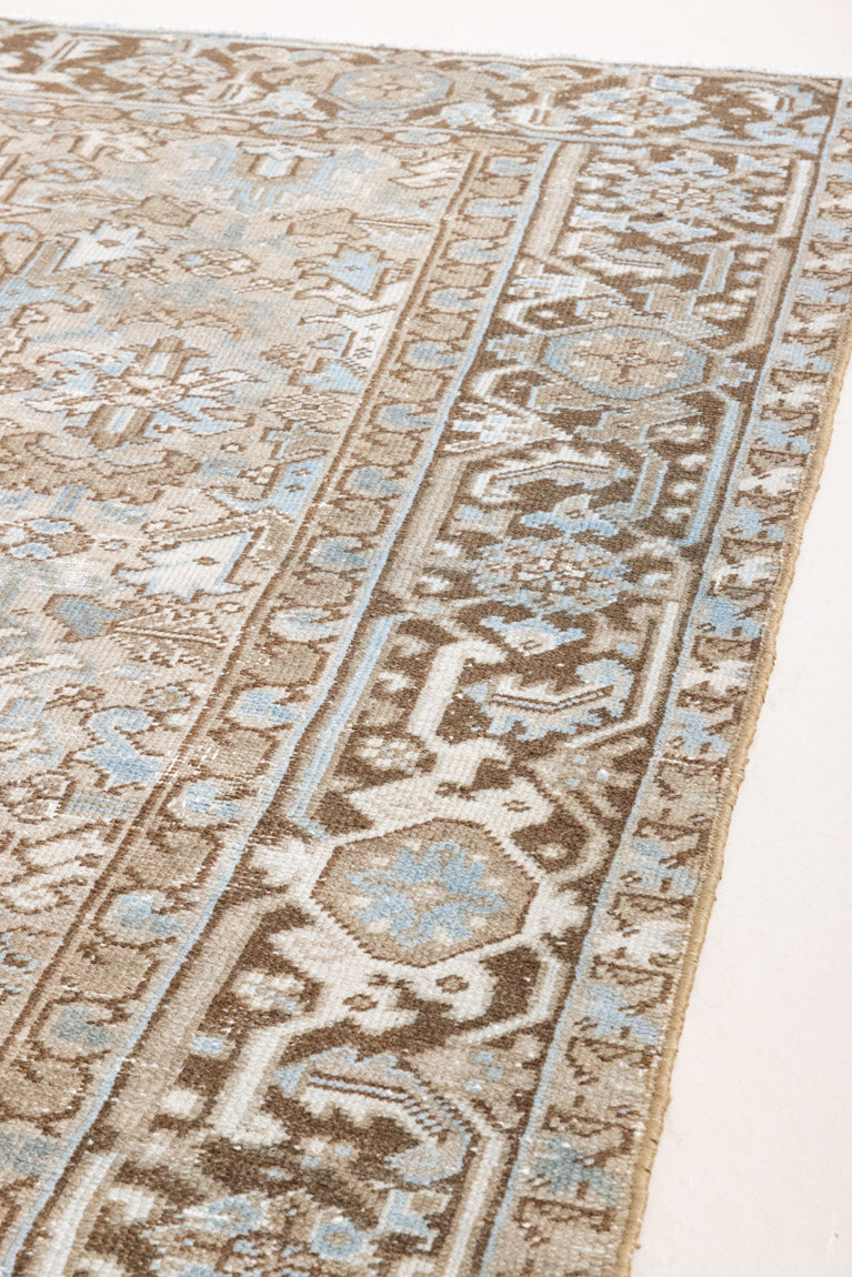 This is a beautiful muted Persian Heriz carpet from Persia. This hand woven rug features a lovely blue grey and brown colour palet.