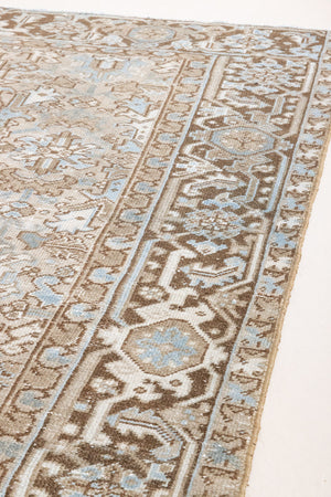 This is a beautiful muted Persian Heriz carpet from Persia. This hand woven rug features a lovely blue grey and brown colour palet.