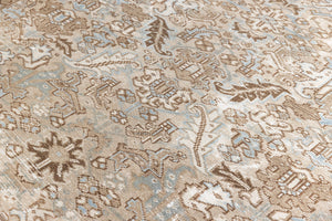 This is a beautiful muted Persian Heriz carpet from Persia. This hand woven rug features a lovely blue grey and brown colour palet.