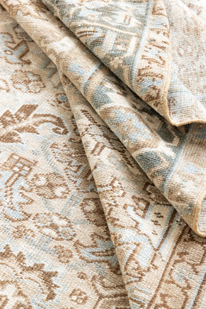 This is a beautiful muted Persian Heriz carpet from Persia. This hand woven rug features a lovely blue grey and brown colour palet.