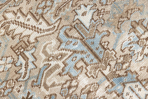 This is a beautiful muted Persian Heriz carpet from Persia. This hand woven rug features a lovely blue grey and brown colour palet.