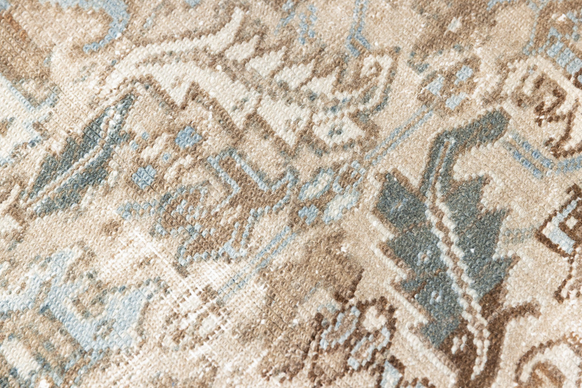 This is a beautiful muted Persian Heriz carpet from Persia. This hand woven rug features a lovely blue grey and brown colour palet.