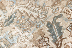 This is a beautiful muted Persian Heriz carpet from Persia. This hand woven rug features a lovely blue grey and brown colour palet.