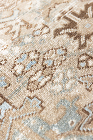 This is a beautiful muted Persian Heriz carpet from Persia. This hand woven rug features a lovely blue grey and brown colour palet.