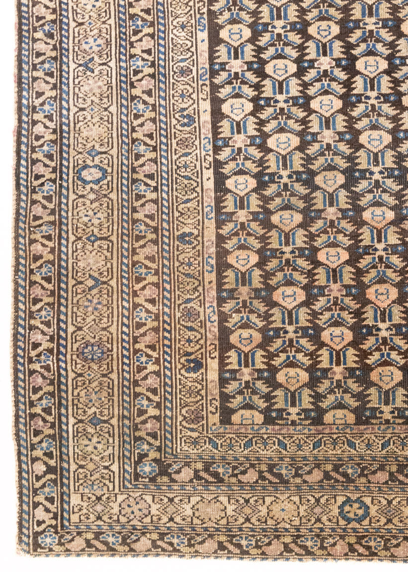 Liberty is a handmade Malayer rug, woven in the North West of Persia. This vintage carpet features a beautifully intricate repeating design and a rare colour palette.