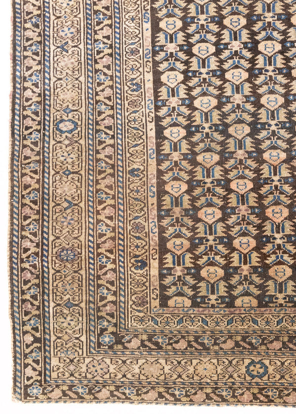 Liberty is a handmade Malayer rug, woven in the North West of Persia. This vintage carpet features a beautifully intricate repeating design and a rare colour palette.