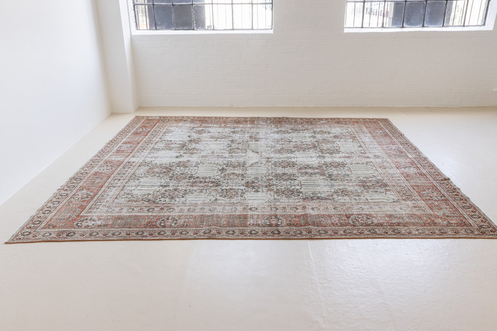 This is a handmade antique Tabriz rug woven in Persia. The Tabriz region is known for producing some of the most ornate Persian carpet, often known for their mesmerising and intricate repeating patterns.
