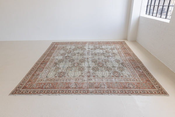 This is a handmade antique Tabriz rug woven in Persia. The Tabriz region is known for producing some of the most ornate Persian carpet, often known for their mesmerising and intricate repeating patterns.
