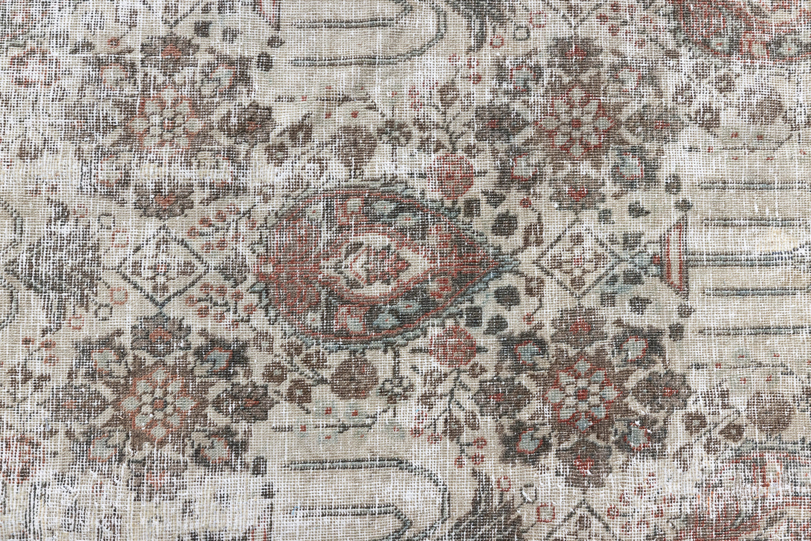 This is a handmade antique Tabriz rug woven in Persia. The Tabriz region is known for producing some of the most ornate Persian carpet, often known for their mesmerising and intricate repeating patterns.