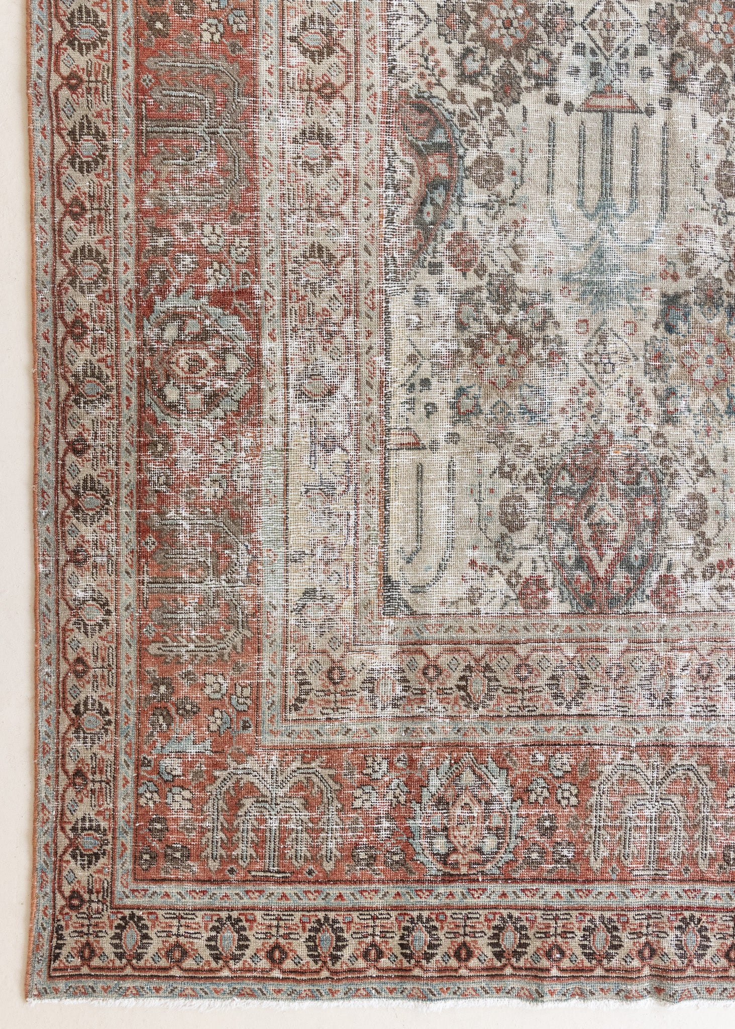 This is a handmade antique Tabriz rug woven in Persia. The Tabriz region is known for producing some of the most ornate Persian carpet, often known for their mesmerising and intricate repeating patterns.