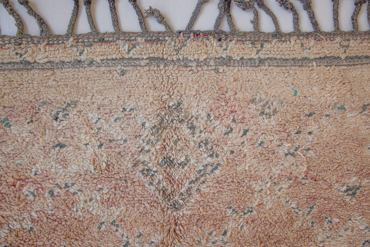 Bloom vintage Beni Ourain rug with a thick textured pile, peach coloured, grey tassels.