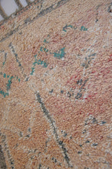 Bloom vintage Beni Ourain rug with a thick textured pile, peach coloured, grey tassels.