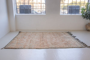 Bloom vintage Beni Ourain rug with a thick textured pile, peach coloured, grey tassels.