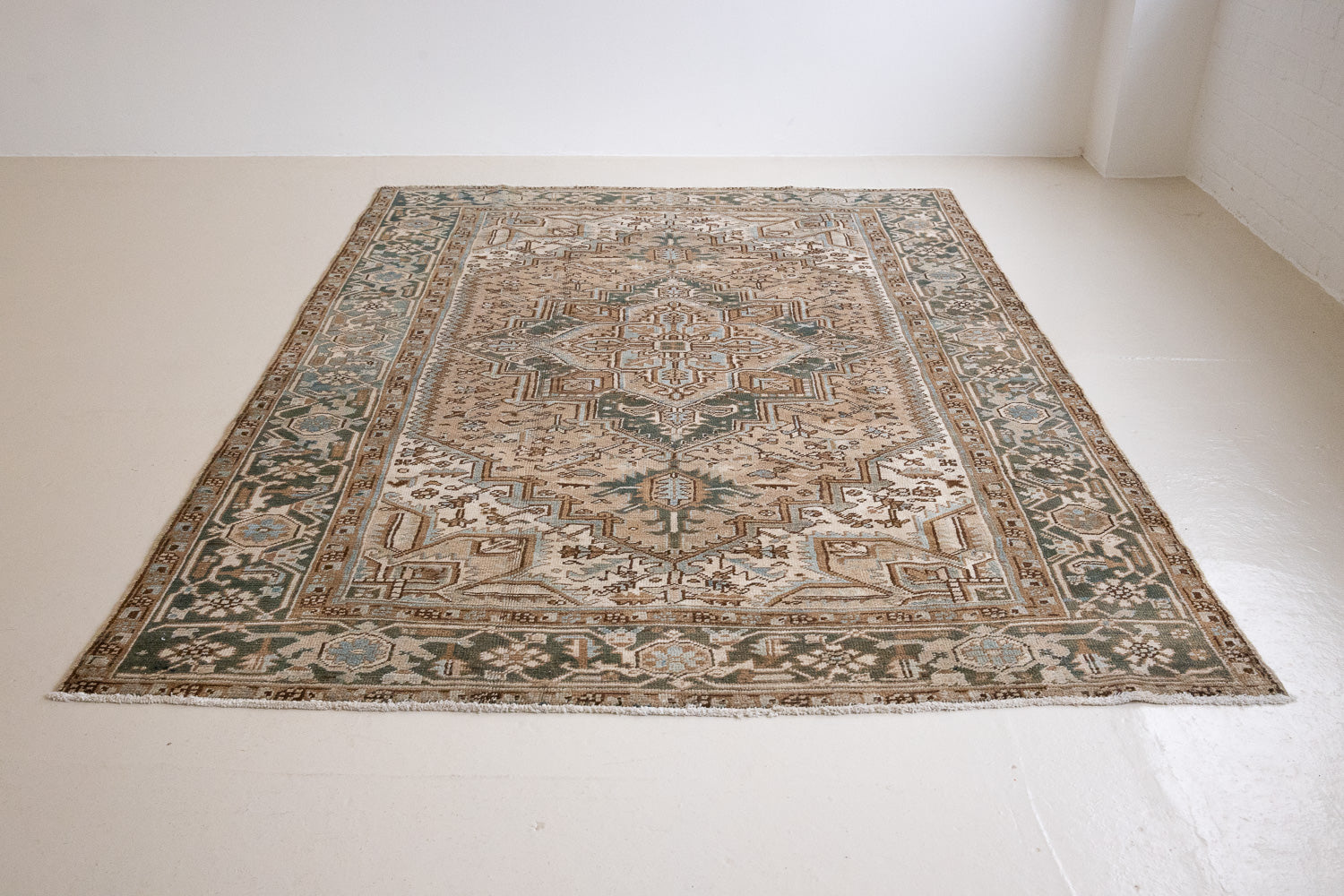 A decorative Heriz rug. Featuring a classic Heriz design in gorgeous soft blue, taupe and cream tones.