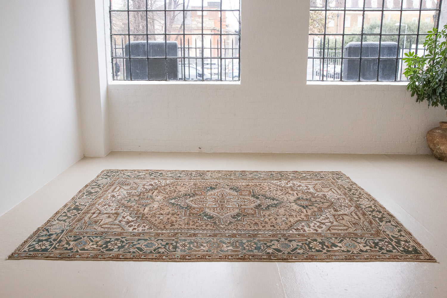 A decorative Heriz rug. Featuring a classic Heriz design in gorgeous soft blue, taupe and cream tones.