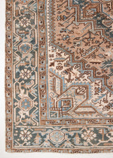 Close-up of a patterned  Heriz rug with intricate designs in brown, beige, and blue. Heriz rugs are some of the most sought after Persian designs and this one features a classic Heriz design in gorgeous soft blue, taupe and cream tones.