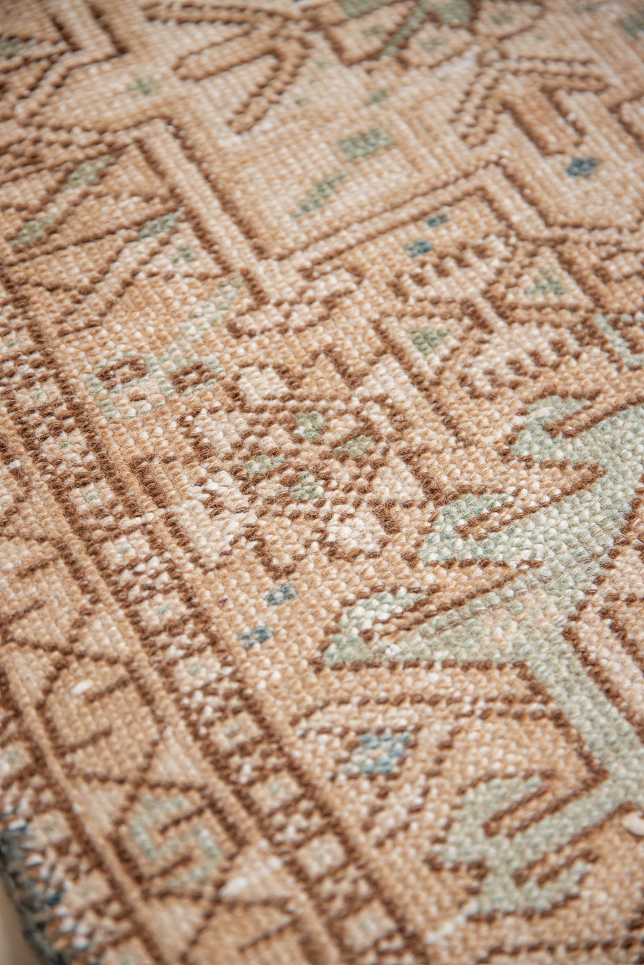 Bonnie is an vintage Persian Heriz runner rug which has been antique washed using a special technique to gently fade its original colours, creating a stunning muted palette. Heriz rugs are some of the most sought after Persian carpets and this one features a classic Heriz design in gorgeous soft blue, taupe and cream tones. 