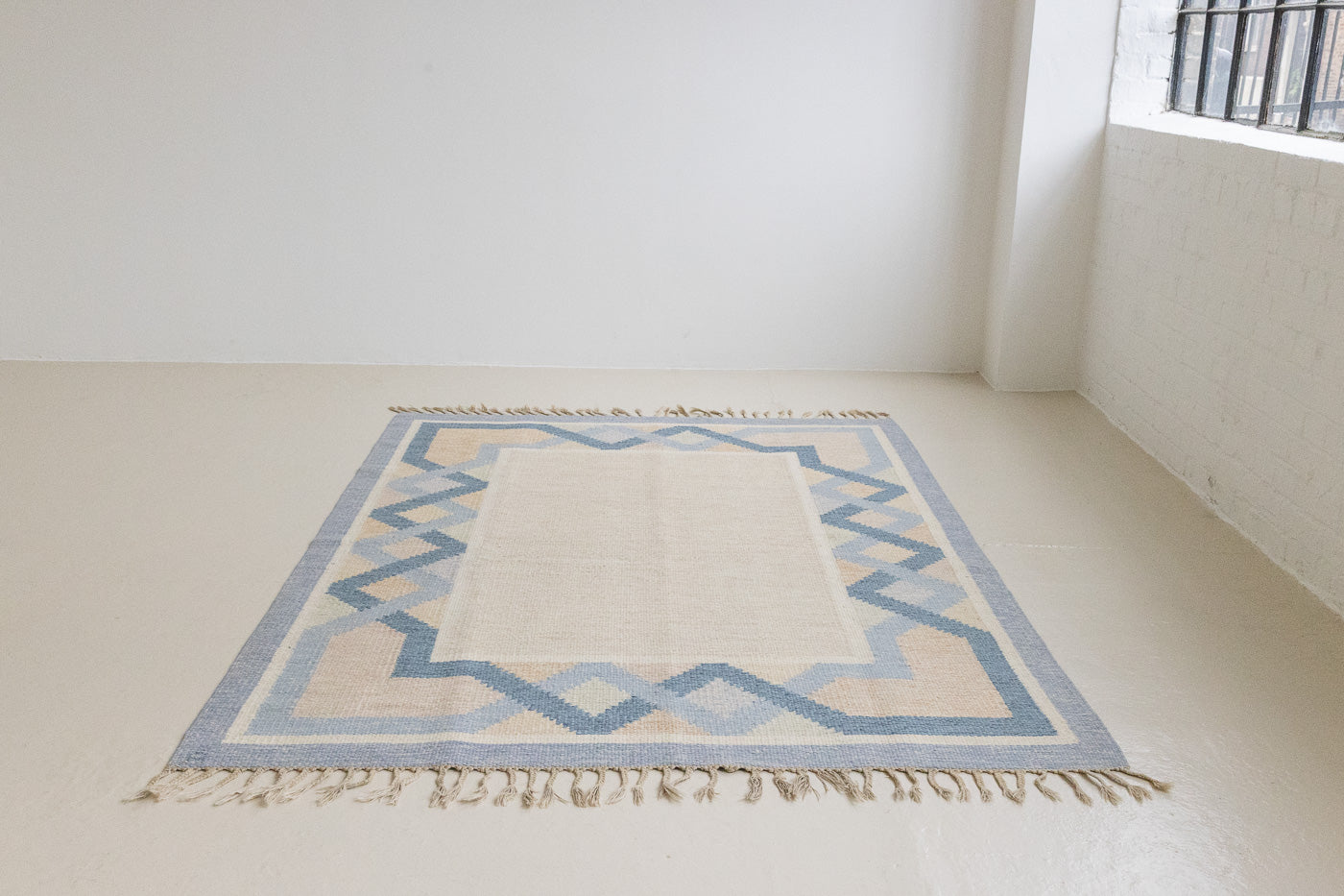 This is a vintage Swedish rug, colourful kilims often feature strong lines and designs inspired by floral and botanical motifs. 