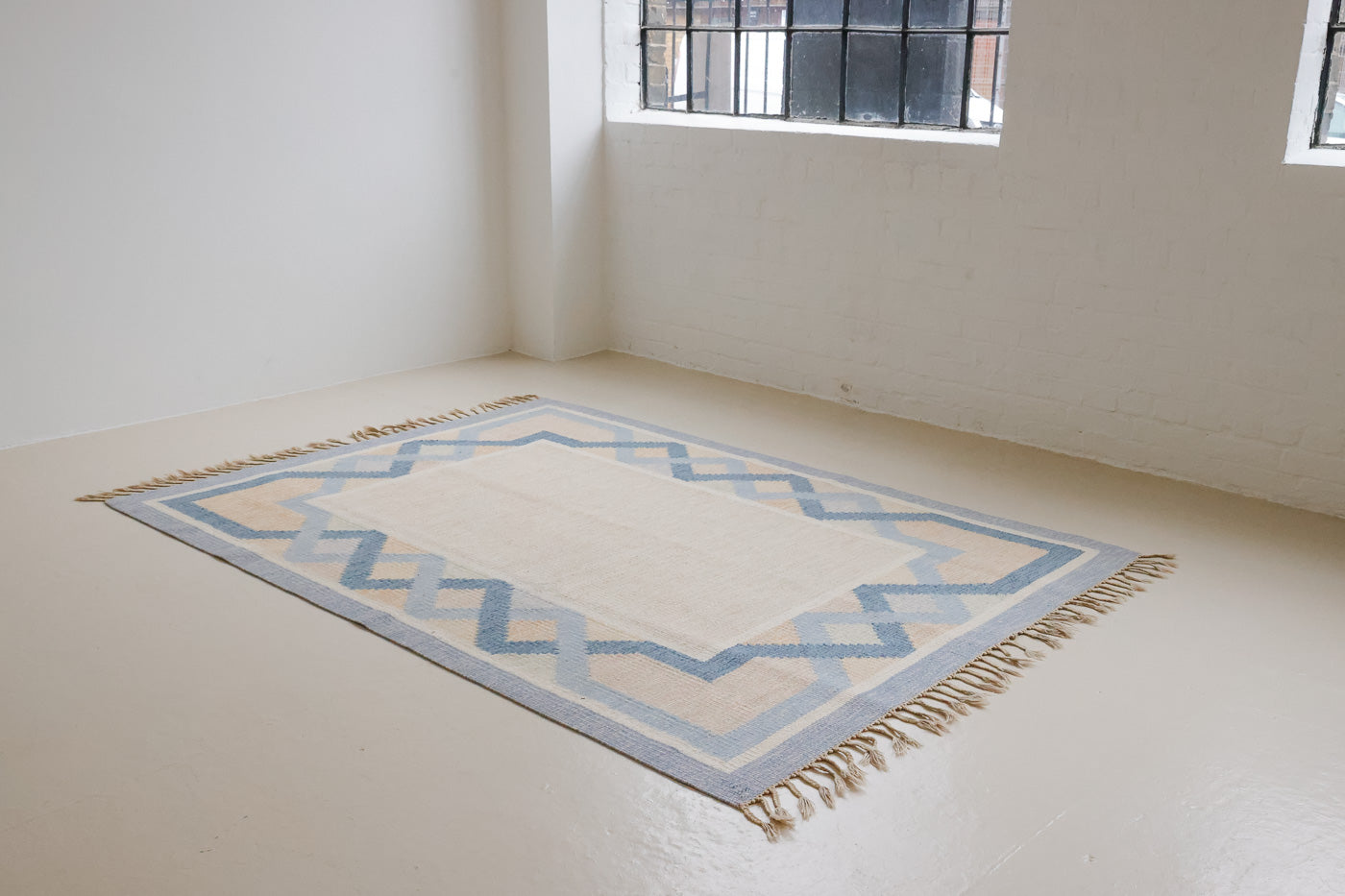 This is a vintage Swedish rug, colourful kilims often feature strong lines and designs inspired by floral and botanical motifs. 