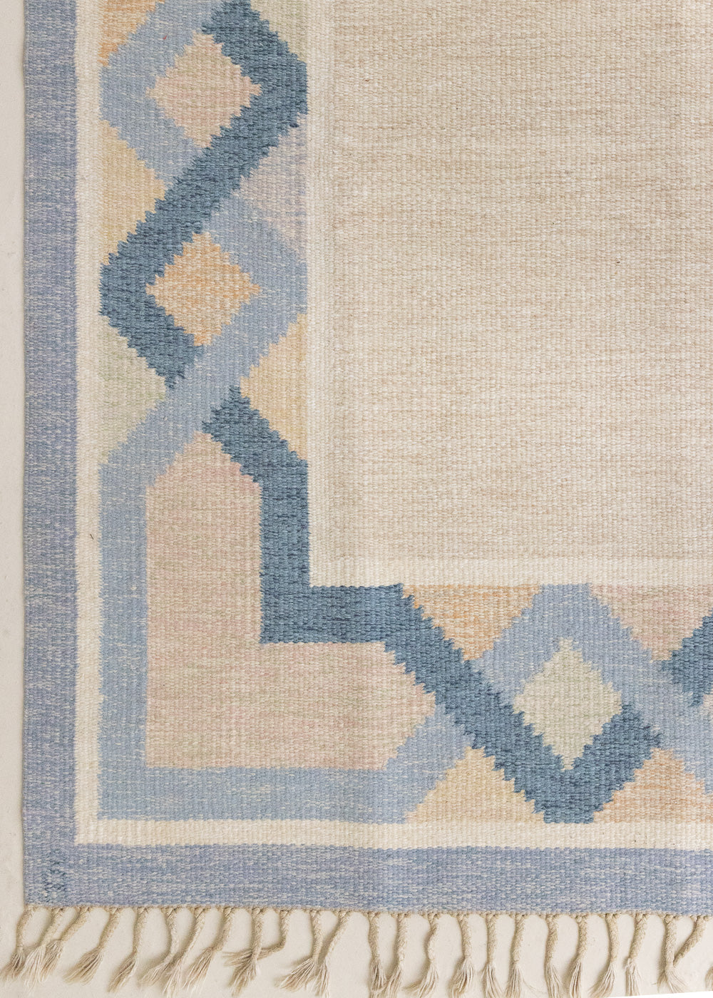 This is a vintage Swedish rug, colourful kilims often feature strong lines and designs inspired by floral and botanical motifs. 