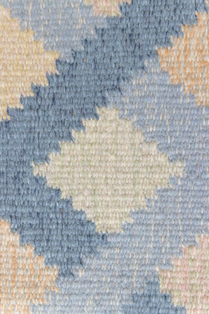 This is a vintage Swedish rug, colourful kilims often feature strong lines and designs inspired by floral and botanical motifs. 