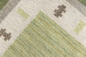  Lilo is an original vintage Swedish röllakan rug from around the 1960s, featuring wonderful palette of various shades of green and ecru tones and a beautifully simple design.