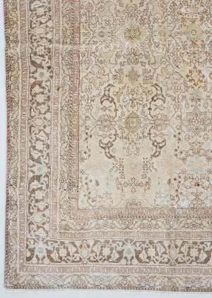 Cecil is a beautiful antique Persian Tabriz rug with a soft and subtle colour palette and in an extra large size. This pretty carpet features highly detailed flowers, palmettes, arabesques and leafy sprays throughout the field and borders, symbolising nature and beauty.