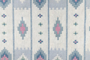 This rug shows beautiful tones of blue, this vintage kilim is featuring bold geometric design with hints of pink within the motifs in the carpet. 