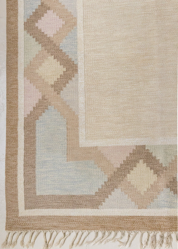 This is an original Swedish röllakan rug handwoven by the mid-century textile designer Anna Johanna Angström. Featuring a geometric patterned rug with pastel colours on a neutral background
