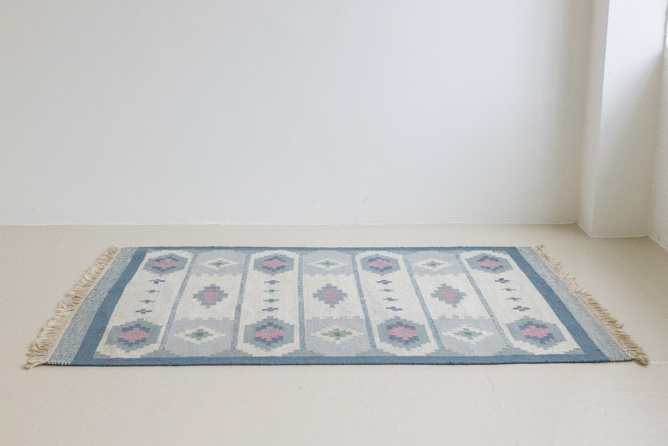 This rug shows beautiful tones of blue, this vintage kilim is featuring bold geometric design with hints of pink within the motifs in the carpet. 