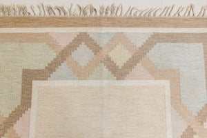 This is an original Swedish röllakan rug handwoven by the mid-century textile designer Anna Johanna Angström. Featuring a geometric patterned rug with pastel colors on a neutral background