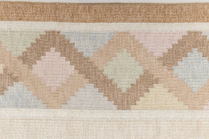 This is an original Swedish röllakan rug handwoven by the mid-century textile designer Anna Johanna Angström. Featuring a geometric patterned rug with pastel colors on a neutral background