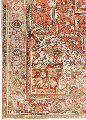 Lainey showcases a classic Heriz composition, centred around a striking medallion set against a soft rust-coloured field, complemented by a light khaki-toned border. Traditional palmette and floral motifs are interpreted through bold, geometric patterns.