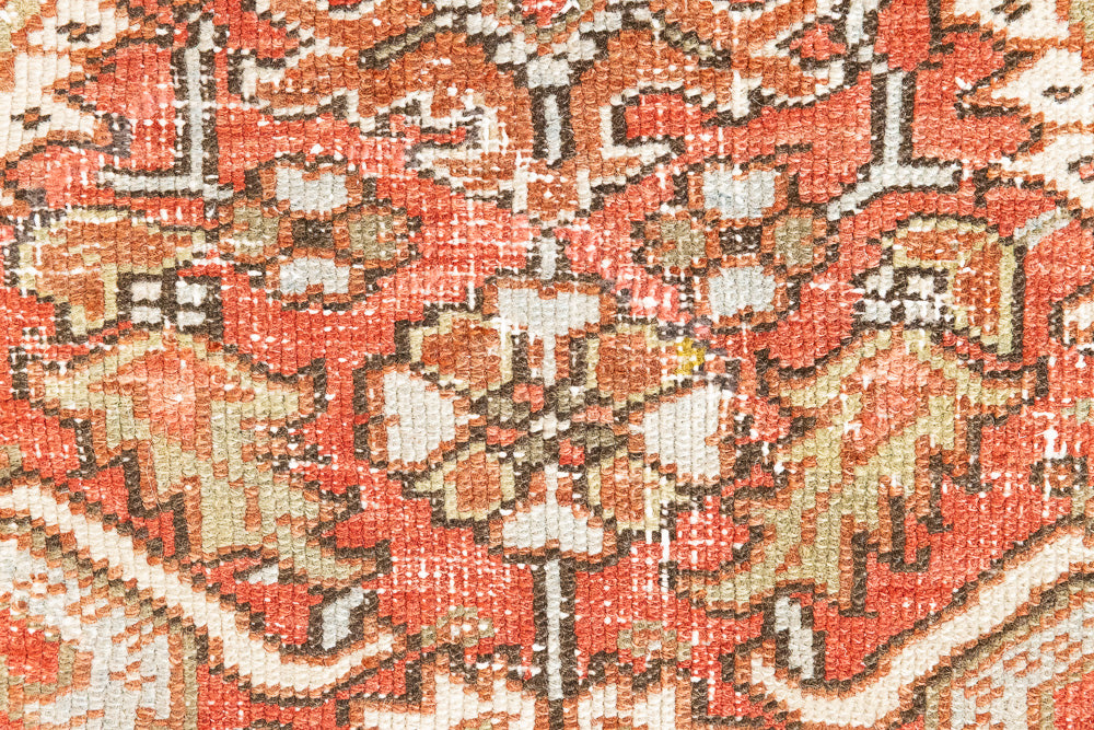 This a Vintage Persian Rug from Heriz in Persia. This hand woven Carpet features a lovely rust red and khaki green colour palette with a central medallion design.
