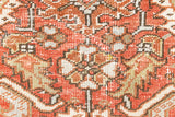 This a Vintage Persian Rug from Heriz in Persia. This hand woven Carpet features a lovely rust red and khaki green colour palette with a central medallion design.