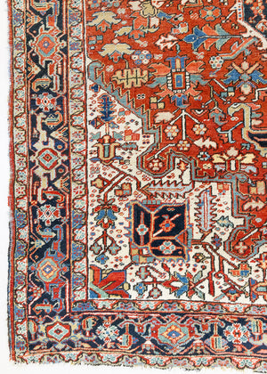 This a Vintage Persian Rug from Heriz in Persia. This hand woven Carpet features a lovely red ground with a central medallion design.