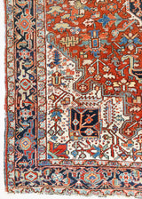 This a Vintage Persian Rug from Heriz in Persia. This hand woven Carpet features a lovely red ground with a central medallion design.