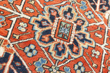 This a Vintage Persian Rug from Heriz in Persia. This hand woven Carpet features a lovely red ground with a central medallion design.