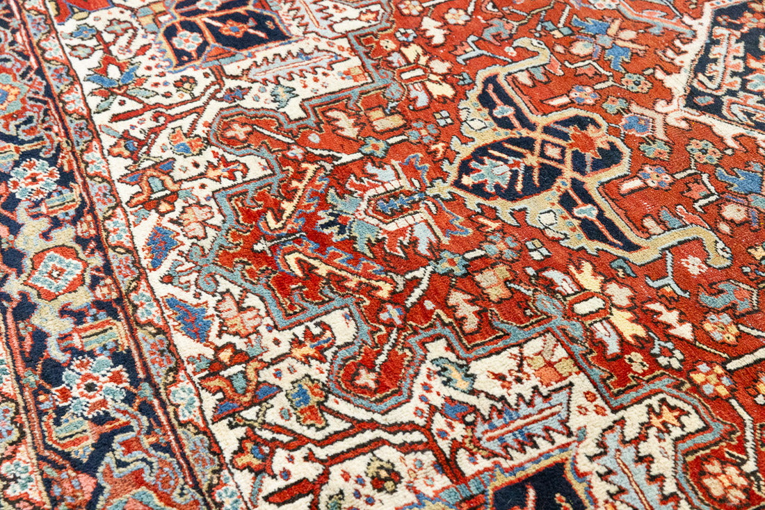This a Vintage Persian Rug from Heriz in Persia. This hand woven Carpet features a lovely red ground with a central medallion design.