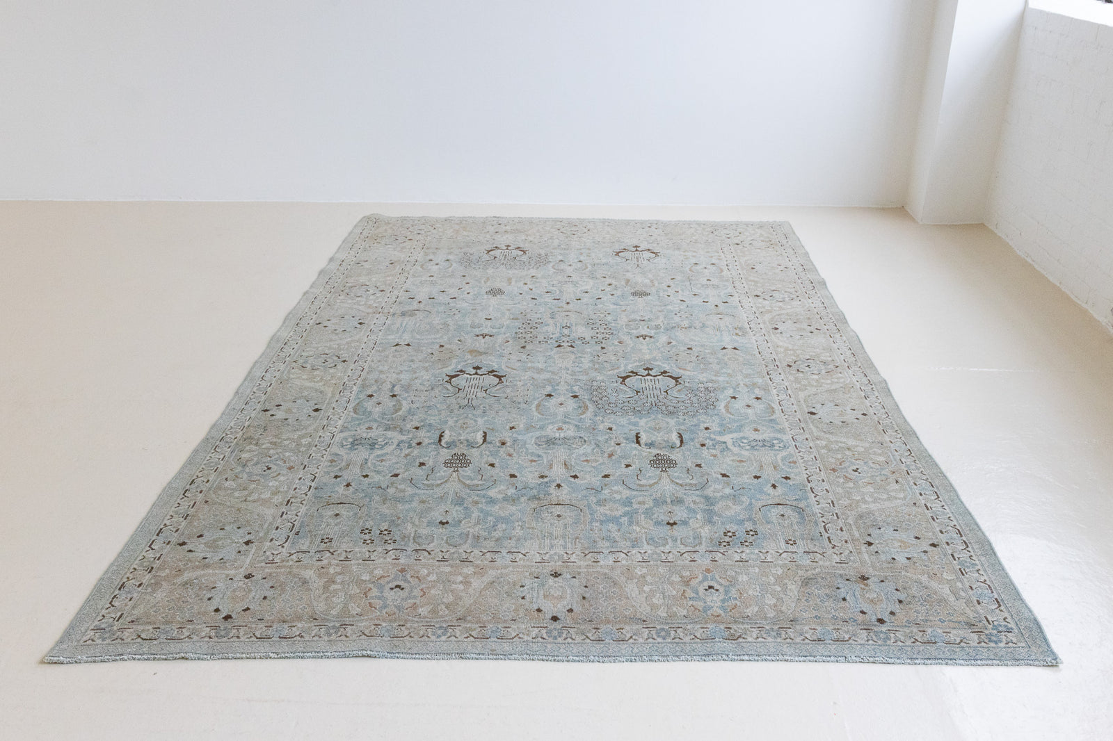 Iris is an antique Persian Tabriz rug with a lovely muted colour palette and an intricate all over design. Iris features a beautiful repeat Tree of Life pattern symbolising growth and eternity.