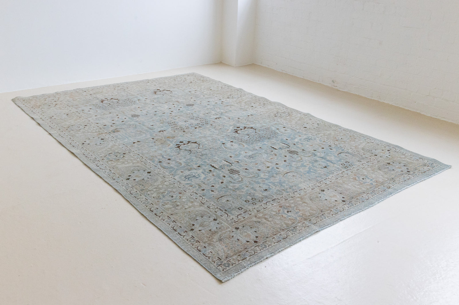 Iris is an antique Persian Tabriz rug with a lovely muted colour palette and an intricate all over design. Iris features a beautiful repeat Tree of Life pattern symbolising growth and eternity.