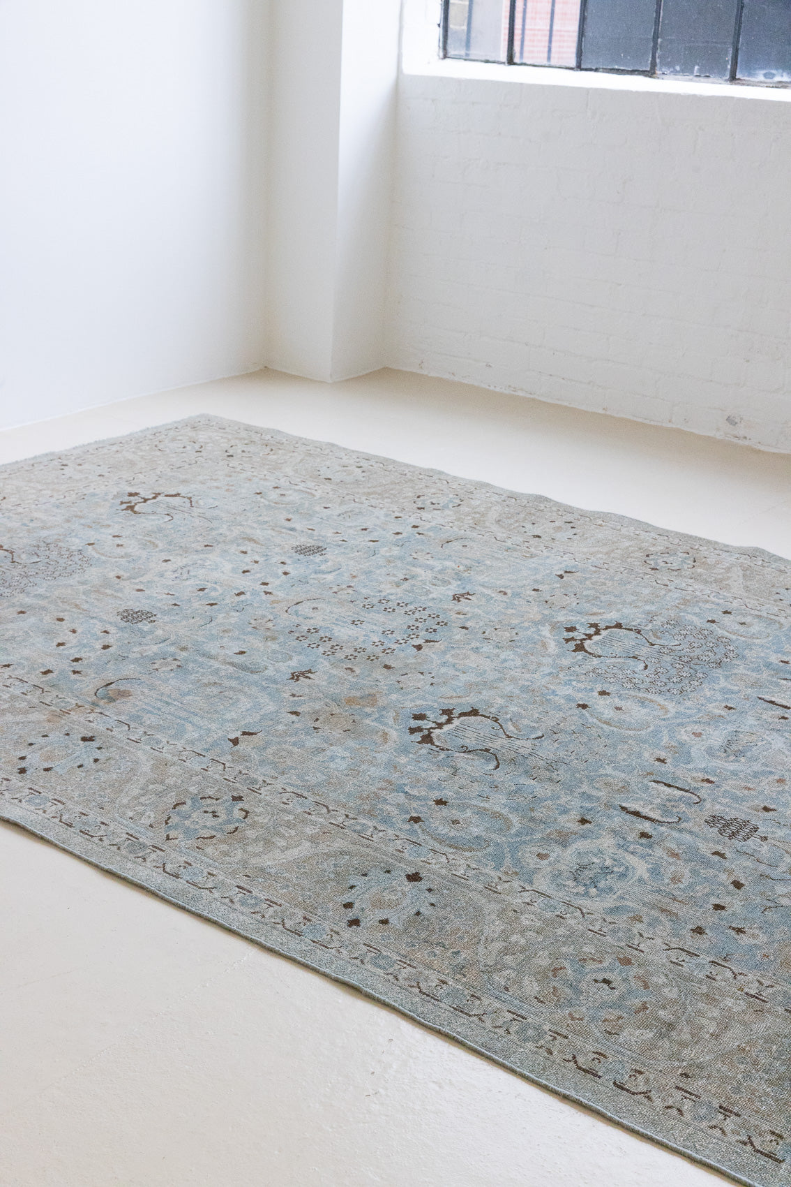 Iris is an antique Persian Tabriz rug with a lovely muted colour palette and an intricate all over design. Iris features a beautiful repeat Tree of Life pattern symbolising growth and eternity.