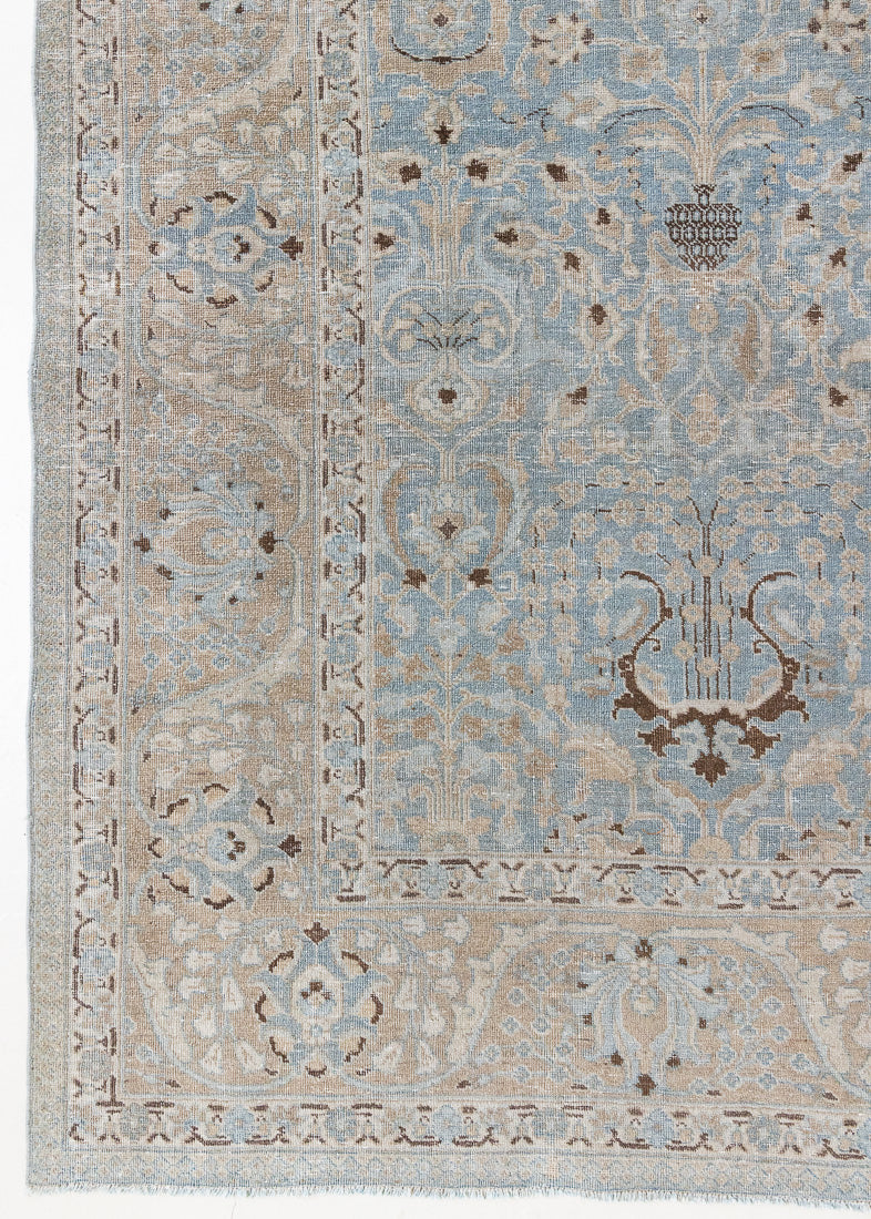 Iris is an antique Persian Tabriz rug with a lovely muted colour palette and an intricate all over design. Iris features a beautiful repeat Tree of Life pattern symbolising growth and eternity.