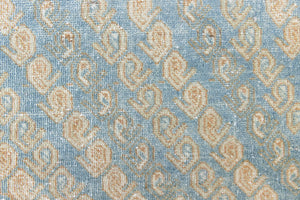 This is an Vintage Qashqai nomadic rug featuring a soft natural blue and orange with beautifully intricate designs within this handwoven carpet, a repeating boteh pattern frames the central diamond motifs.