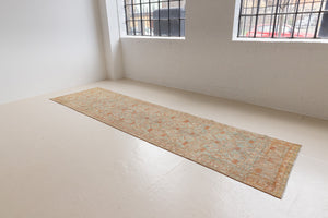 Marisa is a Persian Malayer runner with a beautiful palette of blues and terracotta and a wonderful patina. The pretty floral motif repeats throughout the length of the runner.
