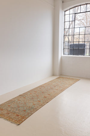 Marisa is a Persian Malayer runner with a beautiful palette of blues and terracotta and a wonderful patina. The pretty floral motif repeats throughout the length of the runner.